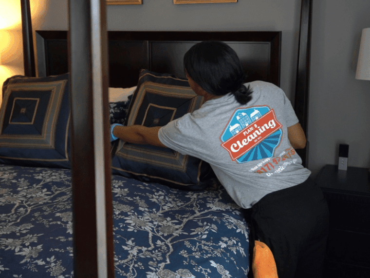 A lady is cleaning the room