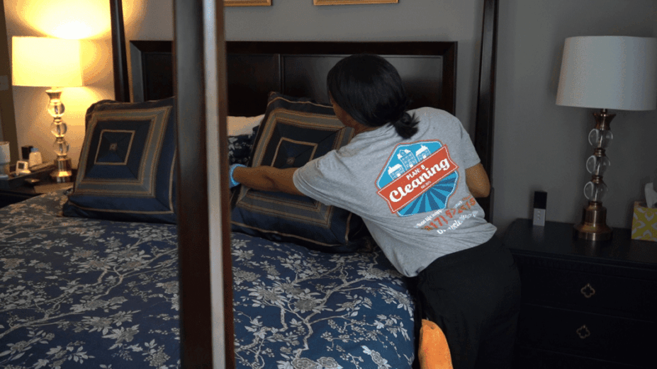 A lady is cleaning the room